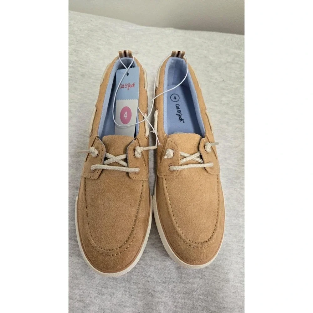 Boys Beige suede boat shoes with white laces. Size: US 4
